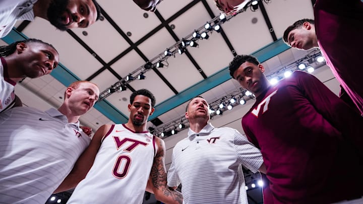 Virginia Tech basketball team in a huddle pregame vs Saint Mary's.