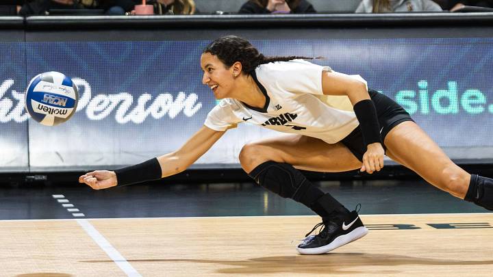 Purdue setter Taylor Anderson attempts to dig a volleyball. Purdue setter Taylor Anderson attempts to dig a volleyball.