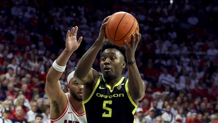 Mar 2, 2024; Tucson, Arizona, USA; Oregon Ducks guard Jermaine Couisnard (5) drives to the net