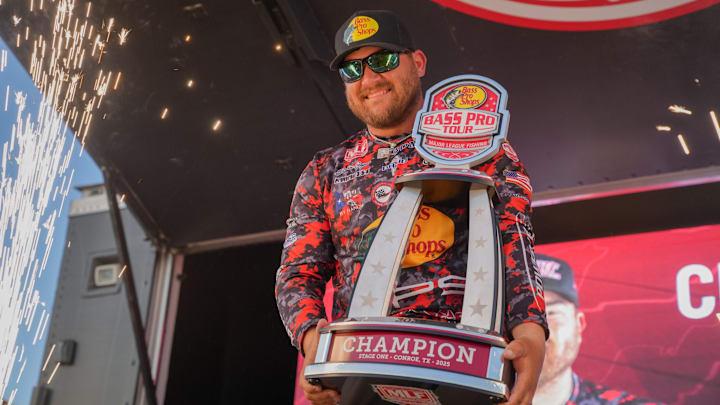 Justin Cooper Holding The Bass Pro Tour Stage 1 Trophy