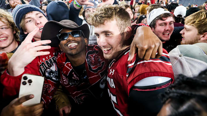 Nov 19, 2022; Columbia, South Carolina, USA; South Carolina Gamecocks linebacker Colin Bryant (45) celebrates with students on the field after defeating the Tennessee Volunteers at Williams-Brice Stadium. Mandatory Credit: Jeff Blake-Imagn Images Nov 19, 2022; Columbia, South Carolina, USA; South Carolina Gamecocks linebacker Colin Bryant (45) celebrates with students on the field after defeating the Tennessee Volunteers at Williams-Brice Stadium. Mandatory Credit: Jeff Blake-Imagn Images