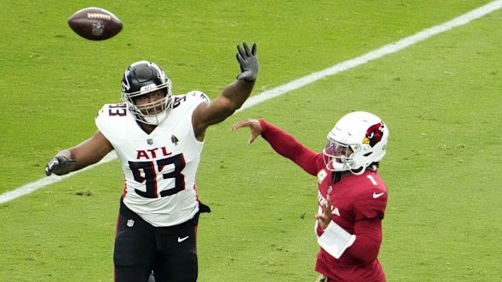 Arizona Cardinals quarterback Kyler Murray (1) throws a pass with pressure from Atlanta Falcons defensive tackle Calais Campbell (93) during his 2023 debut at State Farm Stadium on Nov. 12, 2023, in Glendale.
