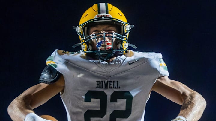 Howell's Bryce Kish flexes after his first touchdown of the evening during a victory over Brighton Friday, Oct. 17, 2025. Howell's Bryce Kish flexes after his first touchdown of the evening during a victory over Brighton Friday, Oct. 17, 2025.