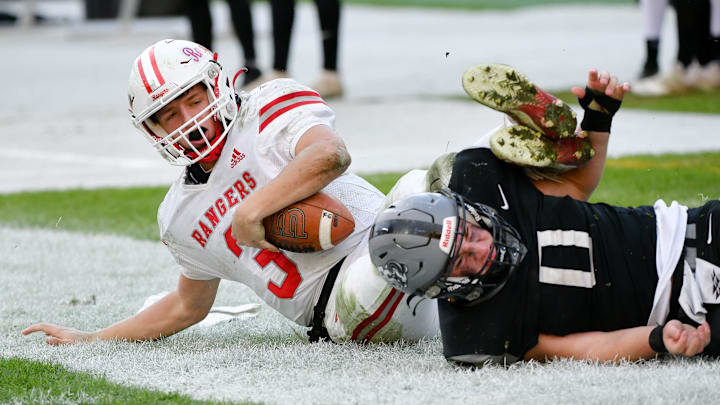South Side's Ryan Navarra tackles Fort Cherry's Matt Sieg during Friday's Class 1A WPIAL