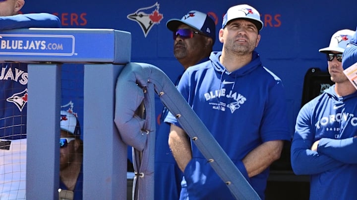 Joey Votto is pictured in the dugout during a Spring Training game between the Baltimore Orioles and Toronto Blue Jays.