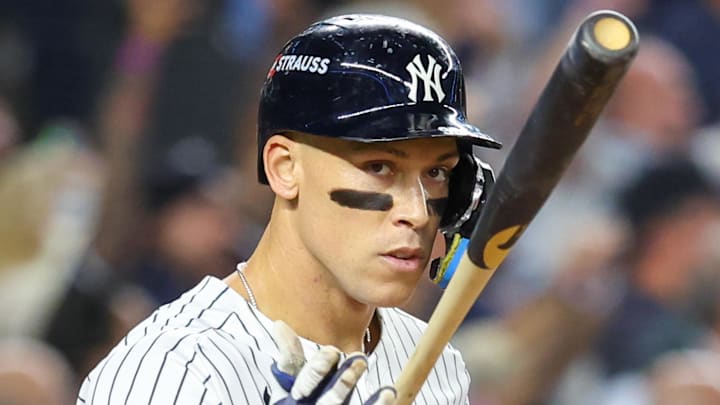 Oct. 7, 2025; Bronx, New York, USA; New York Yankees outfielder Aaron Judge (99) flips his bat after hitting a three-run home run in the fourth inning against the Toronto Blue Jays during game three of the ALDS round for the 2025 MLB playoffs at Yankee Stadium.