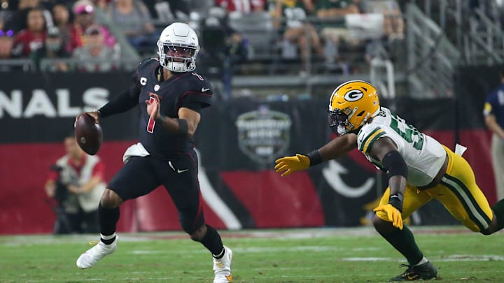 Arizona Cardinals quarterback Kyler Murray scrabbles away from Green Bay Packers defender Rashan Gary (52) on Oct. 28, 2021.