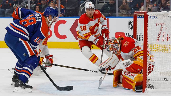 Sep 26, 2026; Edmonton, Alberta, CAN;  Edmonton Oilers forward Zach Hyman (18) scores a goal against Calgary Flames goaltender Dustin Wolf (32) during the first period at Rogers Place.  Mandatory Credit: Perry Nelson-Imagn Images