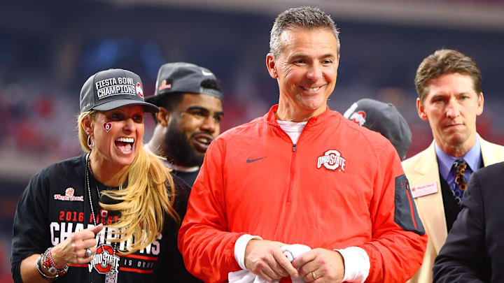 Jan 1, 2016; Glendale, AZ, USA; Ohio State Buckeyes head coach Urban Meyer and wife Shelley Meyer celebrate after defeating the Notre Dame Fighting Irish to win the 2016 Fiesta Bowl at University of Phoenix Stadium. The Buckeyes defeated the Fighting Irish 44-28. Jan 1, 2016; Glendale, AZ, USA; Ohio State Buckeyes head coach Urban Meyer and wife Shelley Meyer celebrate after defeating the Notre Dame Fighting Irish to win the 2016 Fiesta Bowl at University of Phoenix Stadium. The Buckeyes defeated the Fighting Irish 44-28.