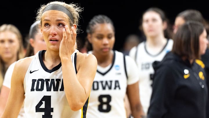 Iowa guard Kylie Feuerbach (4) reacts after the Hawkeyes’ double overtime loss to against the Virginia Cavaliers March 23, 2026 during a Round of 32 NCAA March Madness game at Carver-Hawkeye Arena in Iowa City, Iowa.