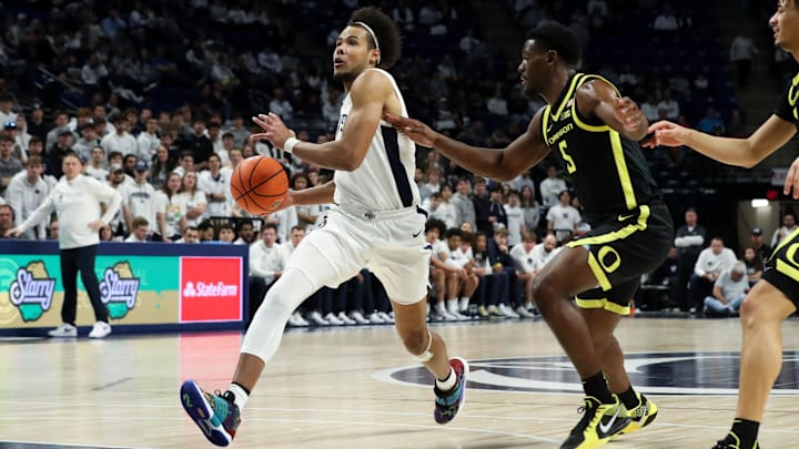 Jan 12, 2025; University Park, Pennsylvania, USA; Penn State Nittany Lions guard/forward Puff Johnson (5) drives the ball towards the basket during the first half against the Oregon Ducks at Bryce Jordan Center. Oregon defeated Penn State 82-81. Mandatory Credit: Matthew O'Haren-Imagn Images