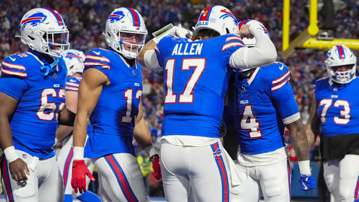 Nov 17, 2024; Orchard Park, New York, USA; Buffalo Bills quarterback Josh Allen (17) congratulates Buffalo Bills running back James Cook (4).