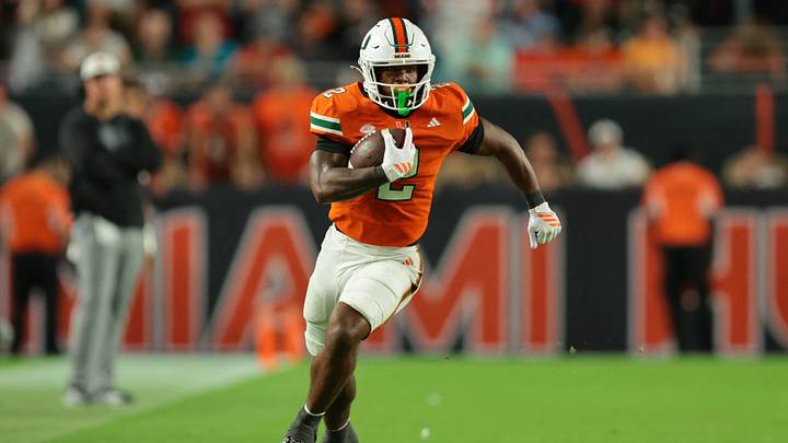 Oct 17, 2025; Miami Gardens, Florida, USA; Miami Hurricanes running back Jordan Lyle (2) carries the football against the Louisville Cardinals during the fourth quarter at Hard Rock Stadium. Mandatory Credit: Sam Navarro-Imagn Images Oct 17, 2025; Miami Gardens, Florida, USA; Miami Hurricanes running back Jordan Lyle (2) carries the football against the Louisville Cardinals during the fourth quarter at Hard Rock Stadium. Mandatory Credit: Sam Navarro-Imagn Images