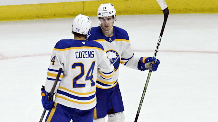 Oct 19, 2024; Chicago, Illinois, USA;  Buffalo Sabres center Ryan McLeod (71) celebrates with center Dylan Cozens (24) after an empty net goal against the Chicago Blackhawks during the third period at the United Center. Mandatory Credit: Matt Marton-Imagn Images