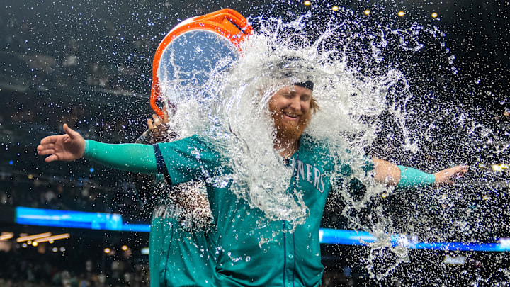 Seattle Mariners pinch hitter Justin Turner is doused with water after a game against the Oakland Athletics on Sept. 28 at T-Mobile Park. Seattle Mariners pinch hitter Justin Turner is doused with water after a game against the Oakland Athletics on Sept. 28 at T-Mobile Park.