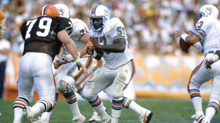 Miami Dolphins center Dwight Stephenson (57) against the Cleveland Browns during the 1985 AFC Divisional Playoff Game at the Orange Bowl.