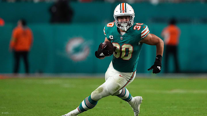 Dec 24, 2023; Miami Gardens, Florida, USA; Miami Dolphins fullback Alec Ingold (30) runs with the ball during the second half against the Dallas Cowboys at Hard Rock Stadium. Dec 24, 2023; Miami Gardens, Florida, USA; Miami Dolphins fullback Alec Ingold (30) runs with the ball during the second half against the Dallas Cowboys at Hard Rock Stadium.