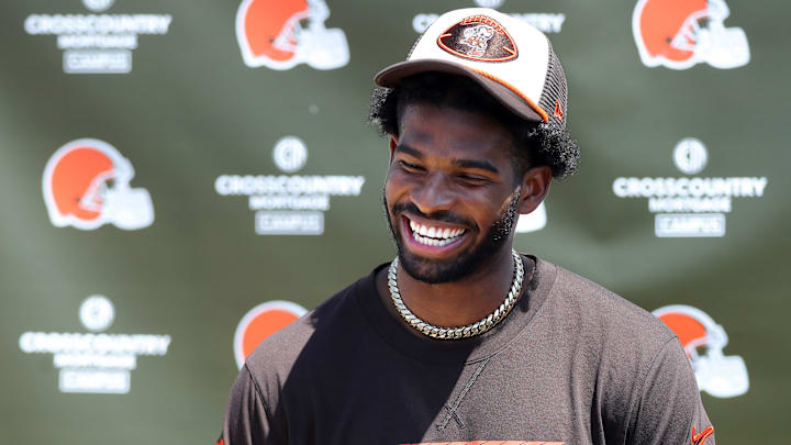 Cleveland Browns quarterback Shedeur Sanders (12) jokes about his signing bonus during a press conference before day two of NFL rookie minicamp at the Cleveland Browns training facility.