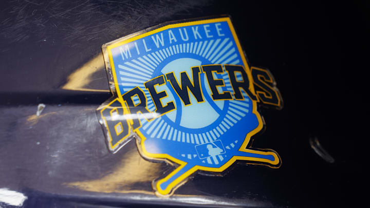 Jun 18, 2023; Milwaukee, Wisconsin, USA;  A Milwaukee Brewers logo on a batting helmet in the dugout prior to the game against the Pittsburgh Pirates at American Family Field. Mandatory Credit: Jeff Hanisch-Imagn Images