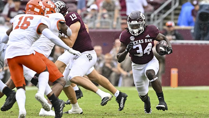 Sep 3, 2022; College Station, Texas, USA;  Texas A&M Aggies running back LJ Johnson Jr. (34) carries the ball during the fourth quarter against the Sam Houston State Bearkats at Kyle Field. Mandatory Credit: Maria Lysaker-Imagn Images