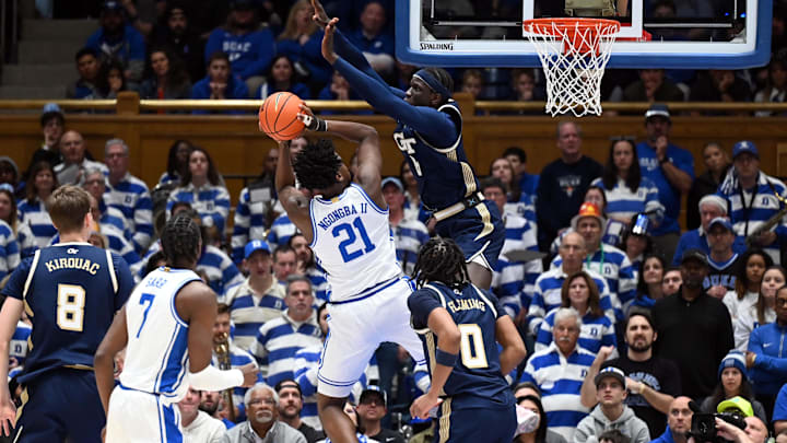 Dec 31, 2025; Durham, North Carolina, USA; Duke Blue Devils center Patrick Ngongba II (21) attempts to shoot over Georgia Tech Yellow Jackets center Mouhamed Sylia (6)during the first half at Cameron Indoor Stadium. Mandatory Credit: Rob Kinnan-Imagn Images