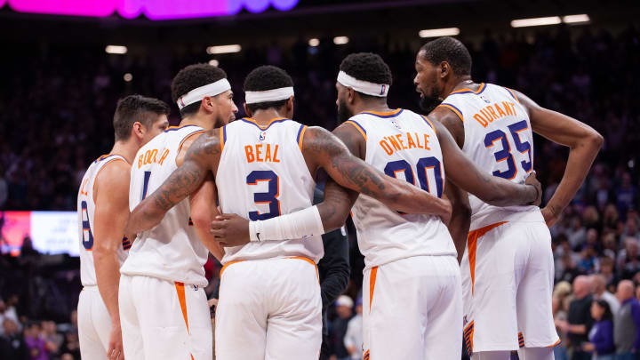 Apr 12, 2024; Sacramento, California, USA; Phoenix Suns guard Grayson Allen (8) and guard Devin Booker (1) and guard Bradley Beal (3) and forward Royce O'Neale (00) and forward Kevin Durant (35) huddle up before the final seconds of the fourth quarter at Golden 1 Center. Mandatory Credit: Ed Szczepanski-USA TODAY Sports