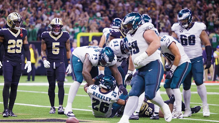 Sep 22, 2024; New Orleans, Louisiana, USA; Philadelphia Eagles running back Saquon Barkley (26) rushes in for touchdown against New Orleans Saints defensive tackle Nathan Shepherd (93) during the second half at Caesars Superdome. Mandatory Credit: Stephen Lew-Imagn Images