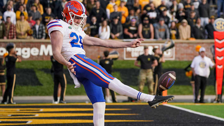 Nov 20, 2021; Columbia, Missouri, USA; Florida Gators punter Jeremy Crawshaw (26) punts out of the end zone against the Missouri Tigers during the first half at Faurot Field at Memorial Stadium. Mandatory Credit: Denny Medley-Imagn Images Nov 20, 2021; Columbia, Missouri, USA; Florida Gators punter Jeremy Crawshaw (26) punts out of the end zone against the Missouri Tigers during the first half at Faurot Field at Memorial Stadium. Mandatory Credit: Denny Medley-Imagn Images