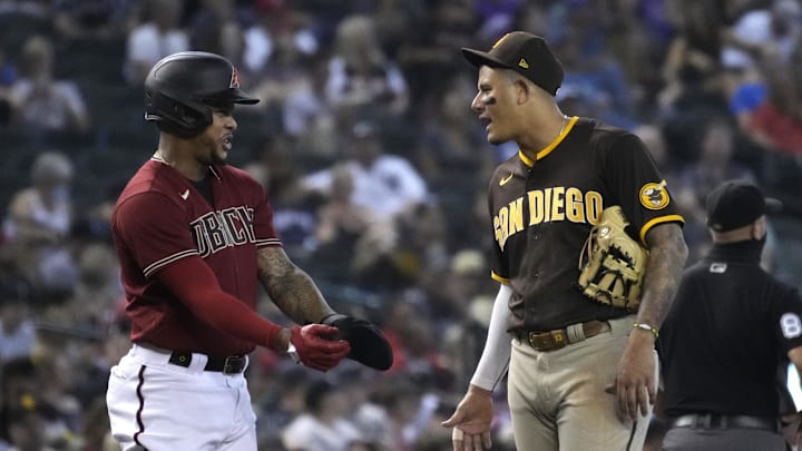 Aug 15, 2021; Phoenix, Arizona, USA; Arizona Diamondbacks second baseman Ketel Marte (left) and San Diego Padres third baseman Manny Machado (13) talk in the third inning at Chase Field. Mandatory Credit: Rick Scuteri-Imagn Images Aug 15, 2021; Phoenix, Arizona, USA; Arizona Diamondbacks second baseman Ketel Marte (left) and San Diego Padres third baseman Manny Machado (13) talk in the third inning at Chase Field. Mandatory Credit: Rick Scuteri-Imagn Images