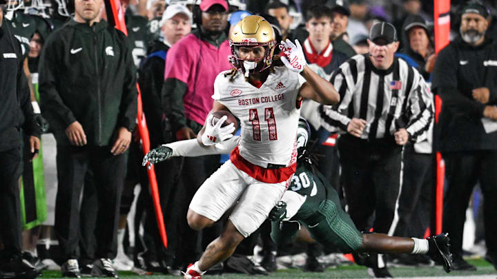 Sep 21, 2024; Chestnut Hill, Massachusetts, USA; Boston College Eagles wide receiver Lewis Bond (11) runs the ball against the Michigan State Spartans during the second half at Alumni Stadium. Mandatory Credit: Eric Canha-Imagn Images