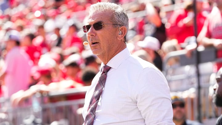 Former Ohio State Buckeyes head coach Urban Meyer, now with Fox Sports, watches on the sideline during the NCAA football game against the Texas Longhorns at Ohio Stadium on Aug. 30, 2025. Former Ohio State Buckeyes head coach Urban Meyer, now with Fox Sports, watches on the sideline during the NCAA football game against the Texas Longhorns at Ohio Stadium on Aug. 30, 2025.