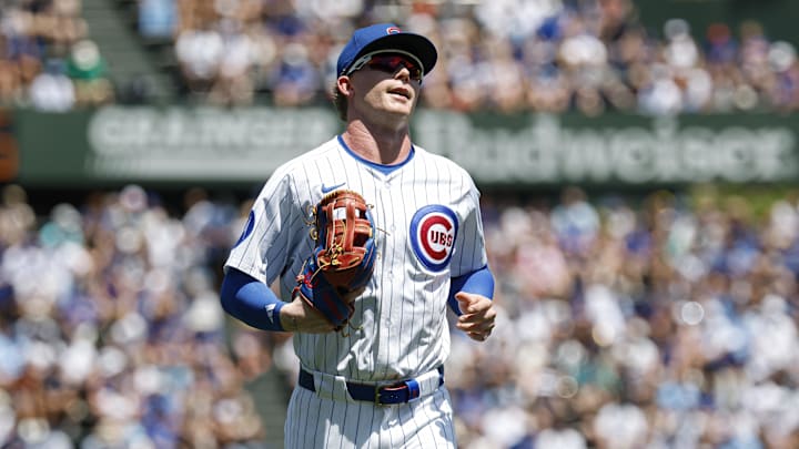 Jun 22, 2025; Chicago, Illinois, USA; Chicago Cubs center fielder Pete Crow-Armstrong (4) returns to the dugout during the first inning of a baseball game against the Seattle Mariners at Wrigley Field. Mandatory Credit: Kamil Krzaczynski-Imagn Images