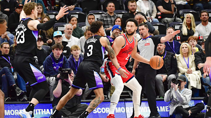 Feb 13, 2025; Salt Lake City, Utah, USA; Utah Jazz guard Keyonte George (3) defends LA Clippers guard/forward Ben Simmons (25) during the first half at the Delta Center. Mandatory Credit: Christopher Creveling-Imagn Images