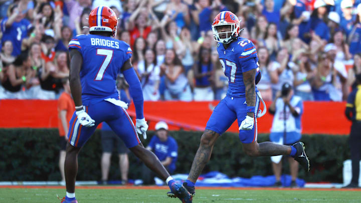 Nov 16, 2024; Gainesville, Florida, USA; Florida Gators defensive back Dijon Johnson (27) celebrate after they stop LSU Tigers on fourth down during the first quarter at Ben Hill Griffin Stadium. Mandatory Credit: Kim Klement Neitzel-Imagn Images