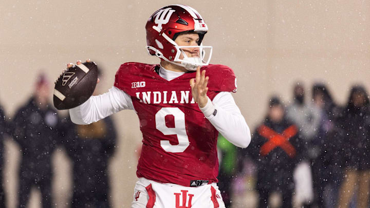 Nov 30, 2024; Bloomington, Indiana, USA; Indiana Hoosiers quarterback Kurtis Rourke (9) drops back to pass the ball  in the first quarter against the Purdue Boilermakers at Memorial Stadium. Mandatory Credit: Trevor Ruszkowski-Imagn Images