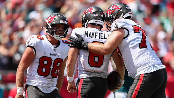 Sep 29, 2024; Tampa, Florida, USA; Tampa Bay Buccaneers tight end Cade Otton (88) congratulates quarterback Baker Mayfield (6) after a touchdown against the Philadelphia Eagles in the second quarter at Raymond James Stadium. Mandatory Credit: Nathan Ray Seebeck-Imagn Images