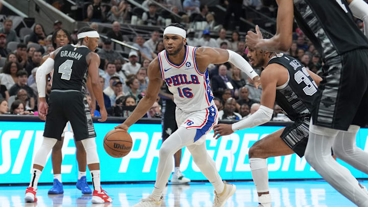 Apr 7, 2024; San Antonio, Texas, USA;  Philadelphia 76ers guard Ricky Council IV (16) dribbles against San Antonio Spurs guard Tre Jones (33) in the second half at Frost Bank Center. Mandatory Credit: Daniel Dunn-USA TODAY Sports