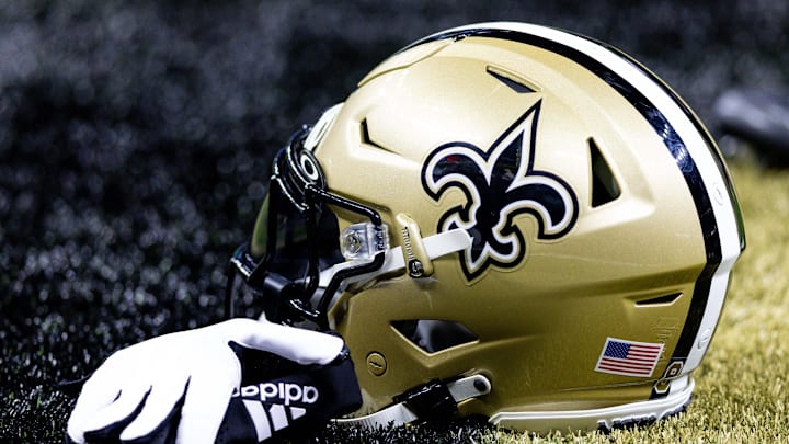Aug 13, 2023; New Orleans, Louisiana, USA;  Detailed view of the New Orleans Saints helmet and glove during pregame against the Kansas City Chiefs at the Caesars Superdome. Mandatory Credit: Stephen Lew-Imagn Images