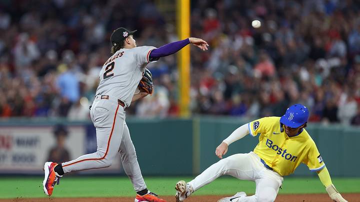 Aug 22, 2026; Boston, Massachusetts, USA; San Francisco Giants shortstop Willy Adames (2) throws over Boston Red Sox second baseman Nick Sogard (20) during the sixth inning at Fenway Park. Mandatory Credit: Paul Rutherford-Imagn Images