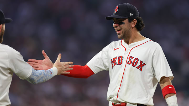 Jun 11, 2025; Boston, Massachusetts, USA; Boston Red Sox third baseman Marcelo Mayer (39) celebrates with Boston Red Sox shortstop Trevor Story (10) during the sixth inning against the Tampa Bay Rays at Fenway Park. Mandatory Credit: Paul Rutherford-Imagn Images