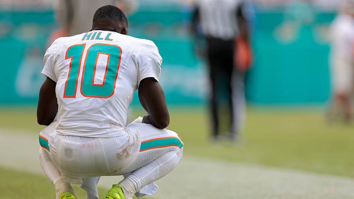 Miami Dolphins wide receiver Tyreek Hill (10) watches from the sideline against the New England Patriots during the fourth quarter at Hard Rock Stadium. Miami Dolphins wide receiver Tyreek Hill (10) watches from the sideline against the New England Patriots during the fourth quarter at Hard Rock Stadium.