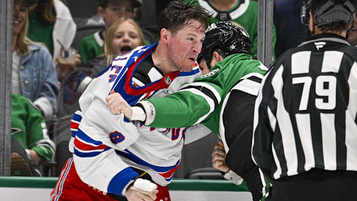 Apr 11, 2026; Dallas, Texas, USA; New York Rangers left wing J.T. Miller (8) fights with Dallas Stars left wing Jamie Benn (14) during the second period at the American Airlines Center. Mandatory Credit: Jerome Miron-Imagn Images