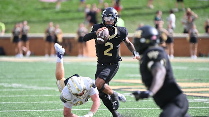 Sep 27, 2025; Winston-Salem, North Carolina, USA;  Georgia Tech Yellow Jackets defensive lineman Jordan van den Berg (99) attempts to tackle Wake Forest Demon Deacons quarterback Robby Ashford (2) during the fourth quarter at Allegacy Federal Credit Union Stadium. Mandatory Credit: Zachary Taft-Imagn Images