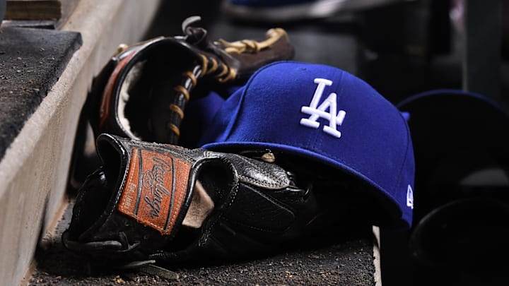 May 13, 2017; Denver, CO, USA; General view the Los Angeles Dodgers cap and glove during the ninth inning against the Colorado Rockies at Coors Field. Mandatory Credit: Ron Chenoy-Imagn Images