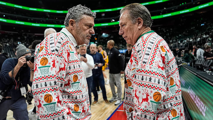 Oakland head coach Greg Kampe, left, talks to Michigan State head coach Tom Izzo before tipoff at Little Caesars Arena in Detroit on Saturday, Dec. 20, 2025. Oakland head coach Greg Kampe, left, talks to Michigan State head coach Tom Izzo before tipoff at Little Caesars Arena in Detroit on Saturday, Dec. 20, 2025.