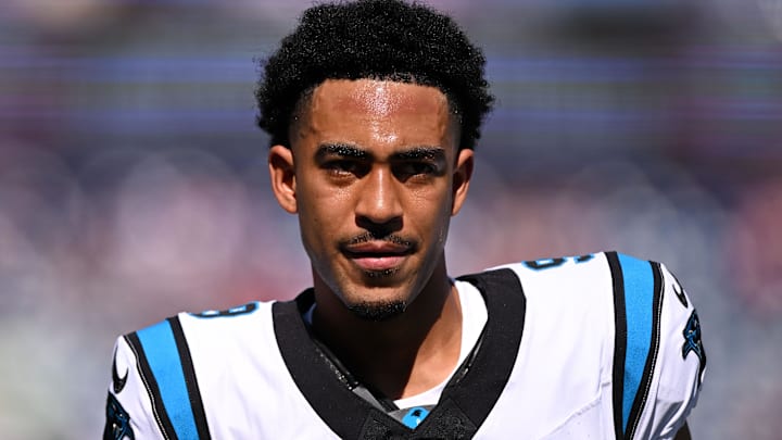 Sep 28, 2025; Foxborough, Massachusetts, USA; Carolina Panthers quarterback Bryce Young (9) runs off of the field during warmups before a game against the New England Patriots at Gillette Stadium. 