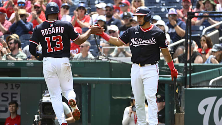 May 7, 2025; Washington, District of Columbia, USA; Washington Nationals third baseman Amed Rosario (13) is congratulated by catcher Keibert Ruiz (20) after scoring a run during the third inning at Nationals Park.
