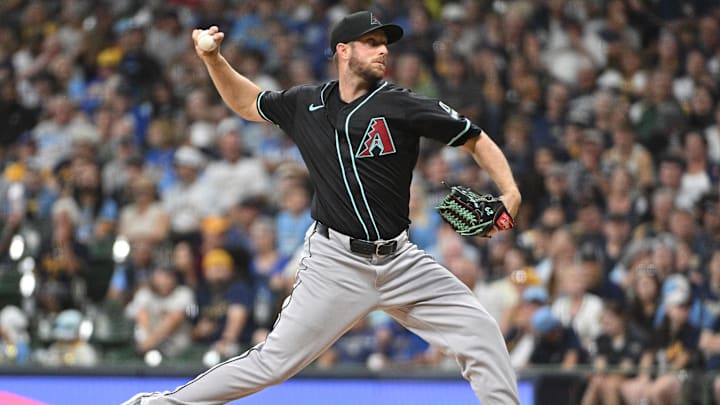 Sep 21, 2024; Milwaukee, Wisconsin, USA; Arizona Diamondbacks pitcher Merrill Kelly (29) delivers a pitch against the Milwaukee Brewers in the first inning at American Family Field. Mandatory Credit: Michael McLoone-Imagn Images
