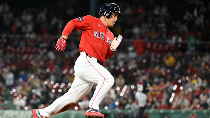 Sep 22, 2024; Boston, MA, USA;  Boston Red Sox designated hitter Masataka Yoshida (7) scores on an RBI by catcher Connor Wong (12)  (not pictured) during the sixth inning against the Minnesota Twins at Fenway Park.