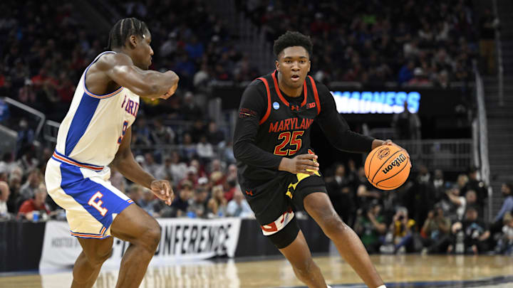 Mar 27, 2025; San Francisco, CA, USA; Maryland Terrapins center Derik Queen (25) dribbles down court past Florida Gators center Rueben Chinyelu (9) during the second half during a West Regional semifinal of the 2025 NCAA tournament at Chase Center. Mandatory Credit: Eakin Howard-Imagn Images